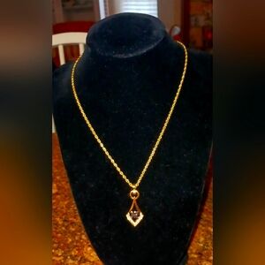 Nina Ricci Elegant Gold Pendant Necklace